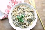 Creamy mushroom alfredo in a white bowl