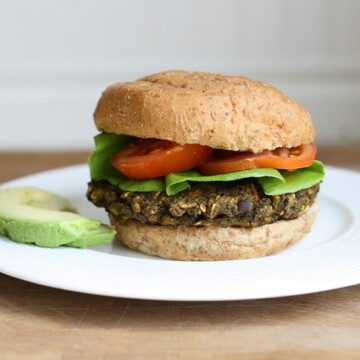 A veggie bean burger on a bun with salad