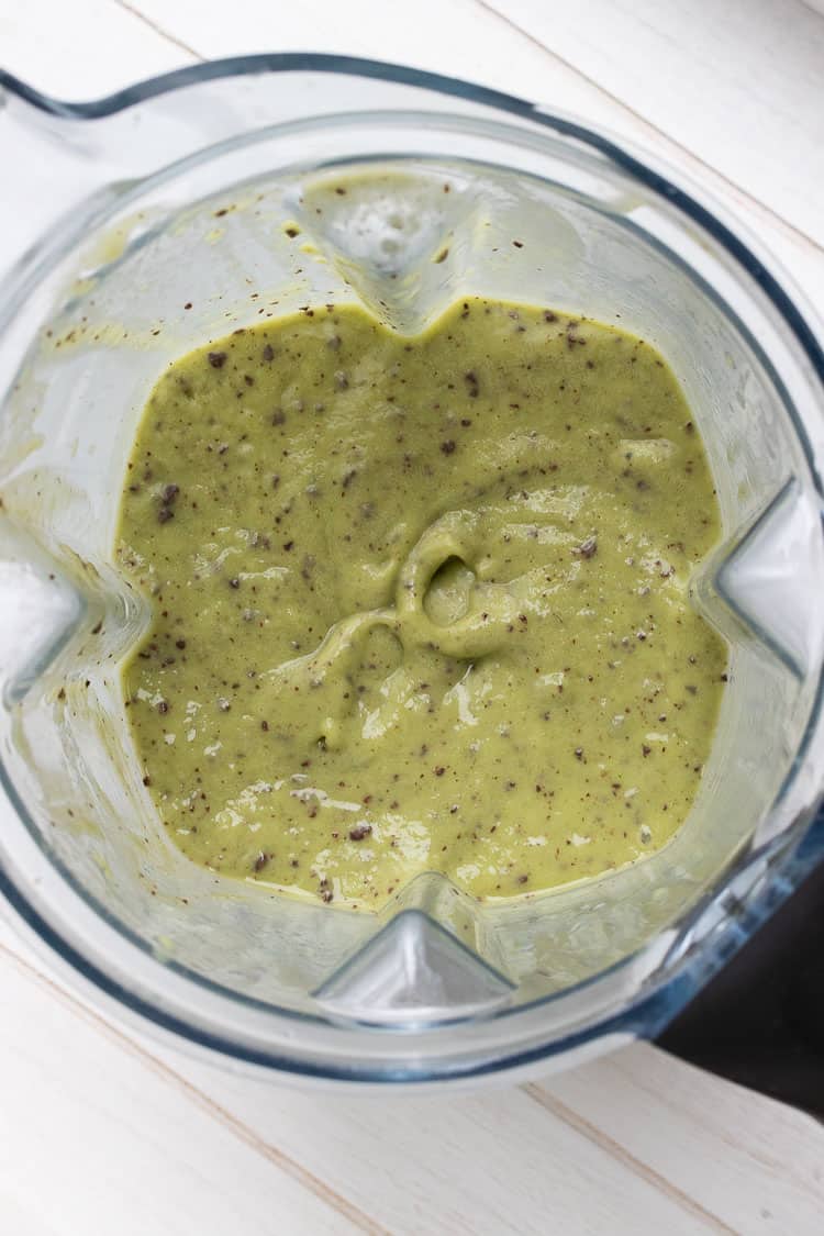 Top view of green smoothie with chocolate chips in a vitamix