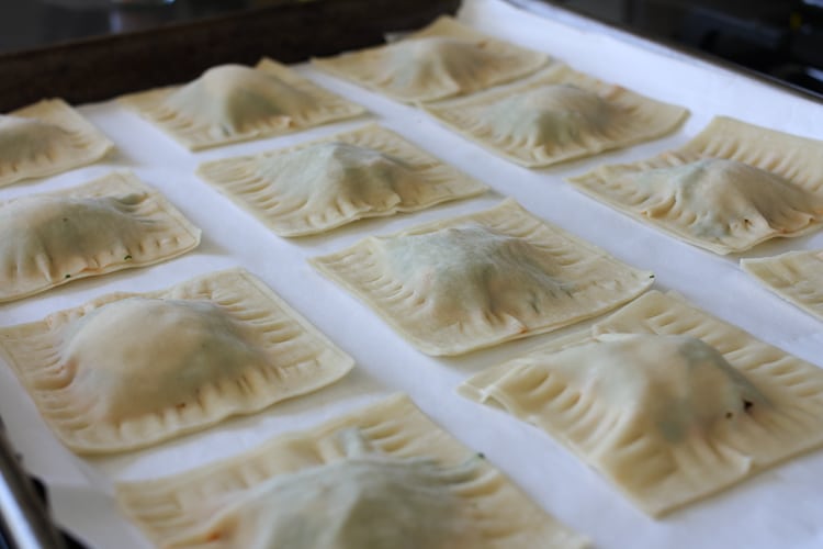 Lasagna wontons on a white surface ready to be cooked