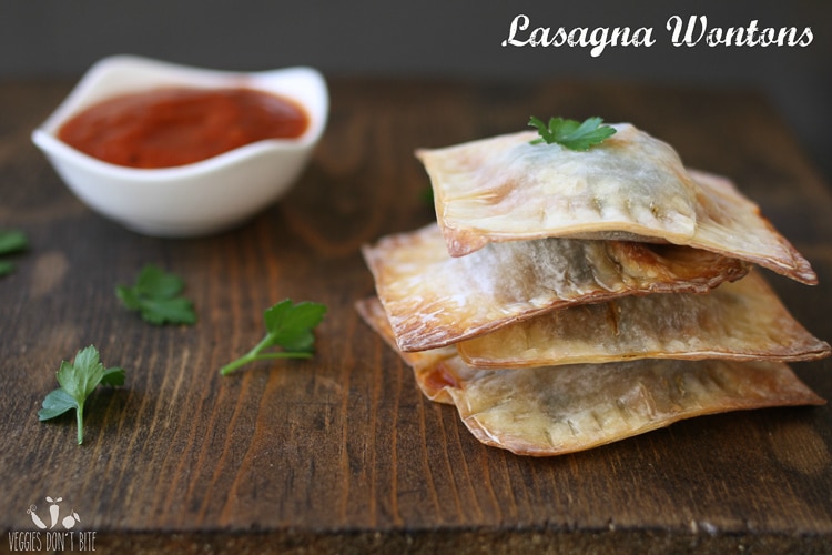 A stack of crispy lasagna wontons on a wooden board