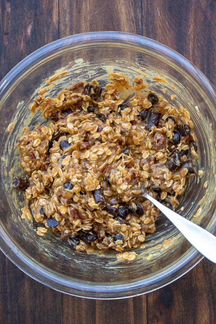 Spoon mixing oatmeal chocolate chip cookie batter