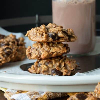 Stack of three oatmeal chocolate chip cookies on a plate