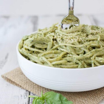 Lemon Hemp Seed Pesto and spaghetti in a bowl with a fork