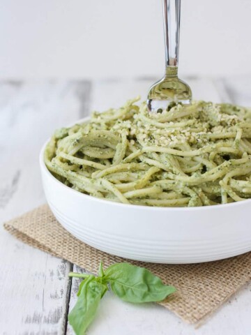 Lemon Hemp Seed Pesto and spaghetti in a bowl with a fork