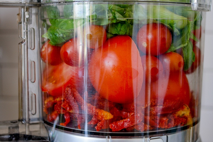 Ingredients to make a raw marinara sauce in a food processor