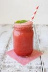 A mason jar filled with a mint watermelon cooler