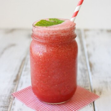 A mason jar filled with a mint watermelon cooler