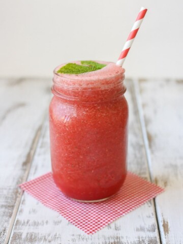 A mason jar filled with a mint watermelon cooler