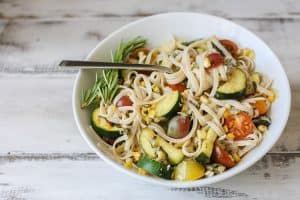 Linguine summer vegetables in a white bowl