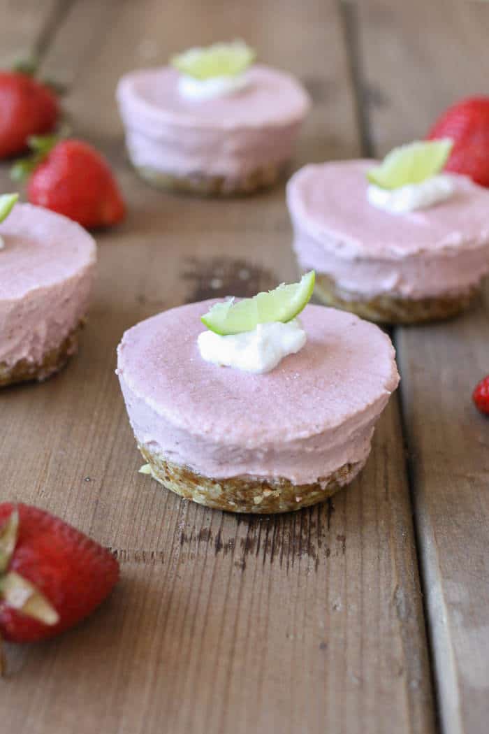 A close up of raw strawberry margarita cheesecake cups