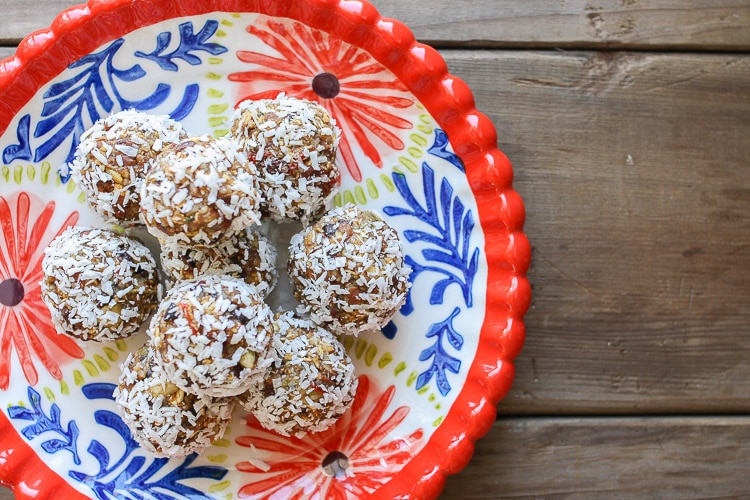 An overhead shot of Raw superfood balls on a red plate