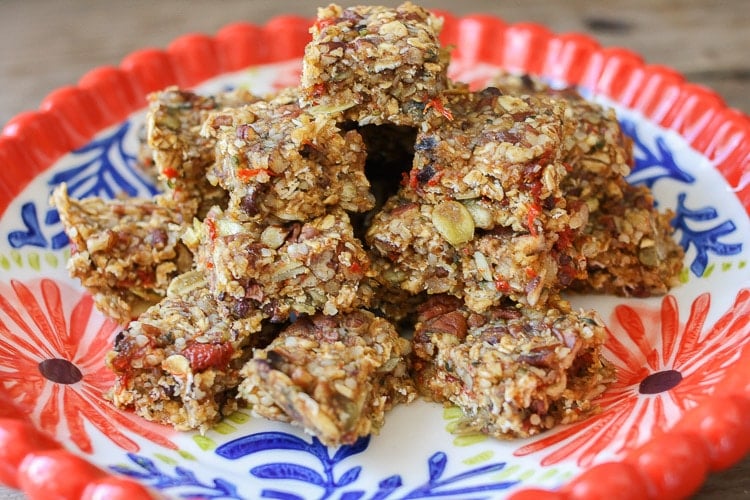 A close up of Raw superfood bars on a red plate