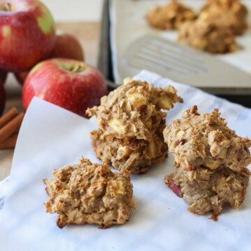 Three Apple Cinnamon Date Muffin Scones sitting on baking parchment