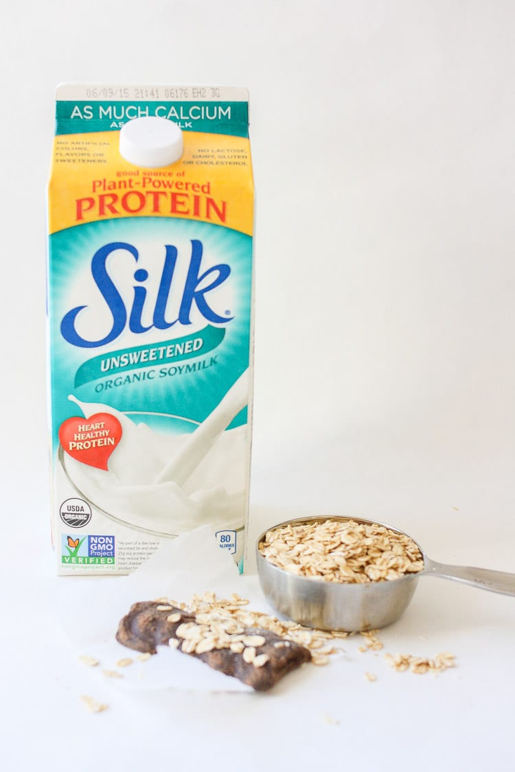 A carton of silk milk and other ingredients used to make a Salted caramel smoothie sitting on a white surface