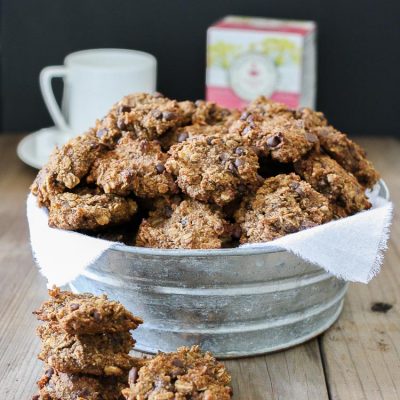 Vegan chocolate chip oat cookies in a bowl piled high