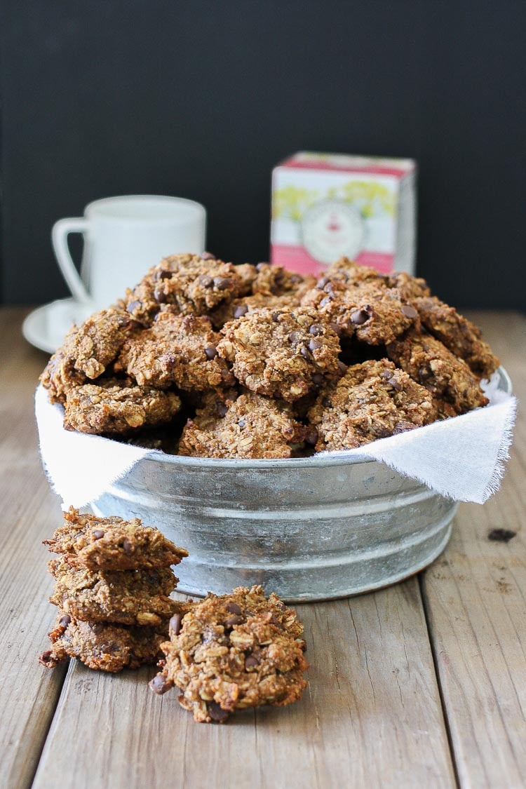 Vegan Chocolate Chip Oat Cookies in a metal bowl sitting on a wooden surface