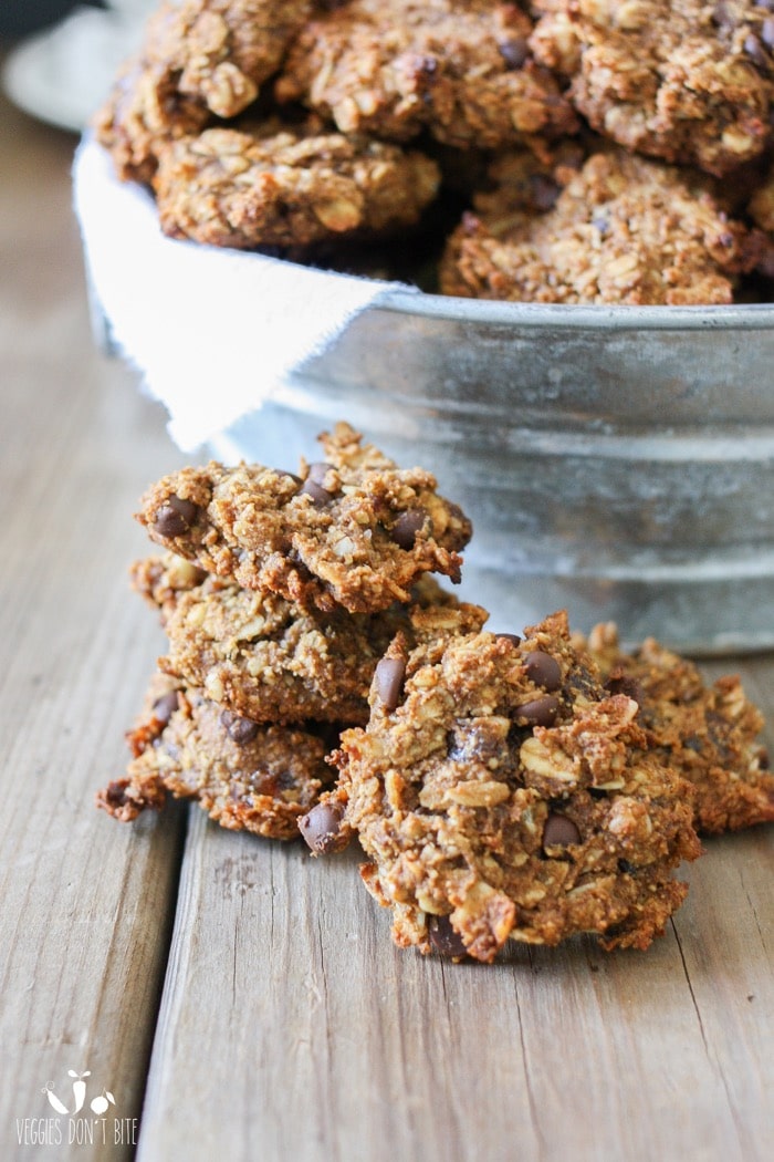 A stack of Chocolate Chip Oat Cookies on a wooden surface