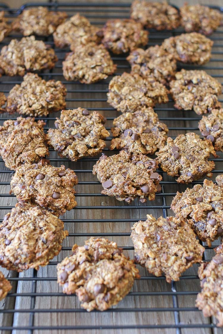 Chocolate chip oat cookies on a wire rack cooling