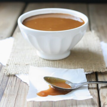 A side shot of Maple Miso Balsamic Sauce in a white bowl