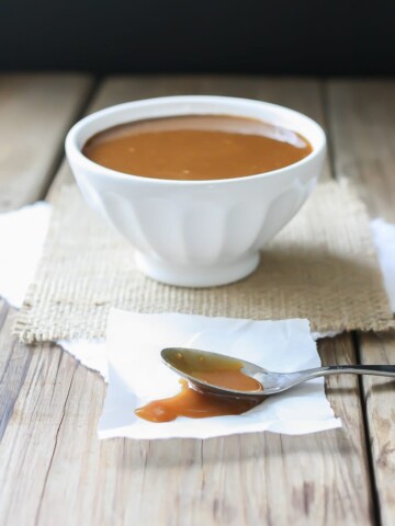 A side shot of Maple Miso Balsamic Sauce in a white bowl