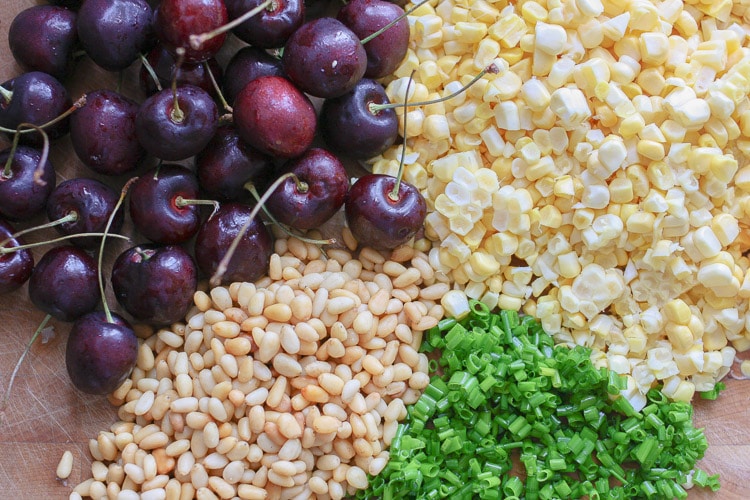 Ingredients on a board for making a vegan arugula salad