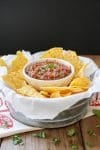 Easy fresh Mexican Salsa in a ramekin with chips beside it
