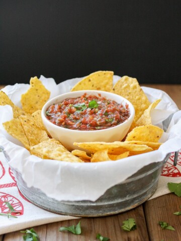 Easy fresh Mexican Salsa in a ramekin with chips beside it