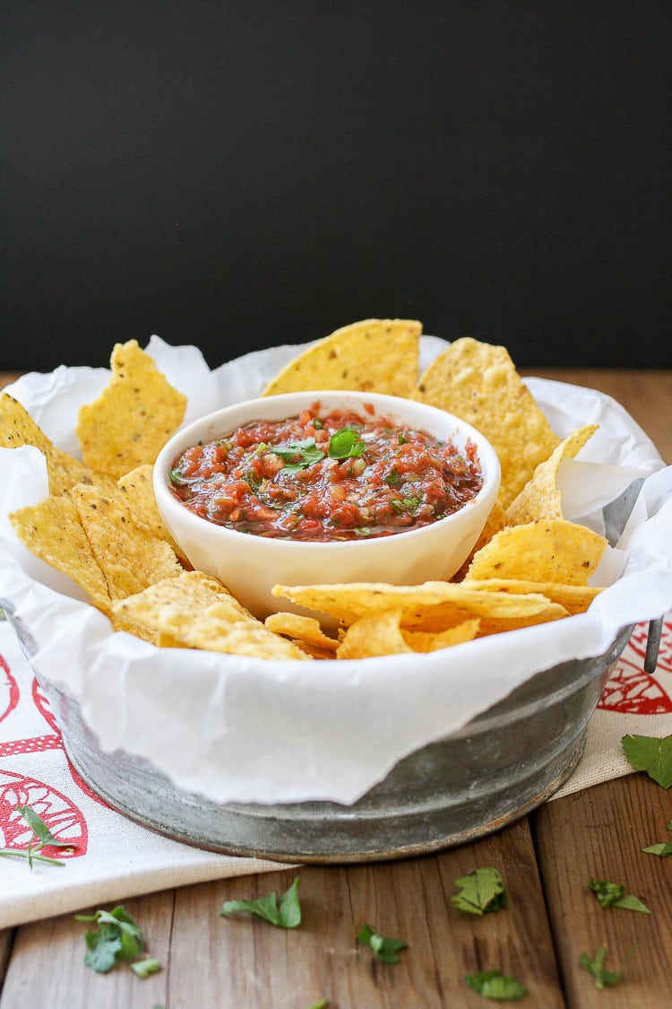 Easy fresh Mexican Salsa in a serving bowl surrounded with chips
