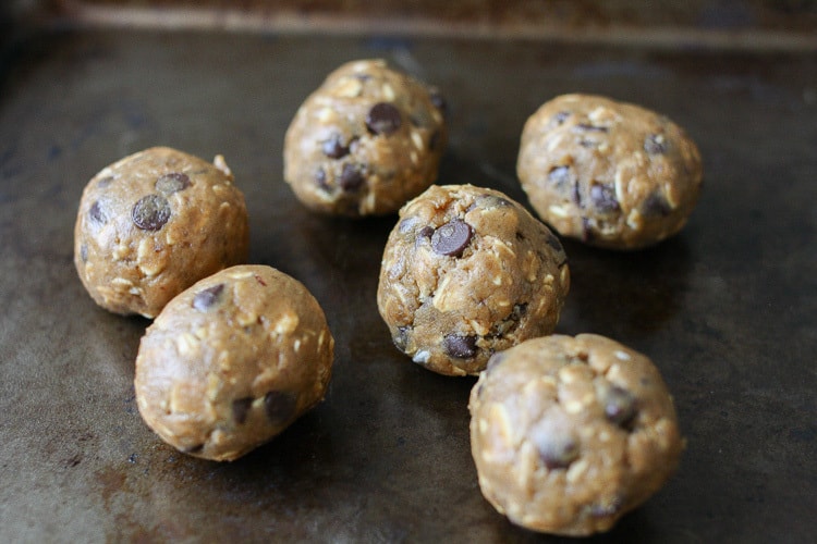 Oatmeal Chocolate Chip Cookie Dough Balls‬‬‬‬‬‬‬‬‬‬‬ on a baking sheet ready to be baked