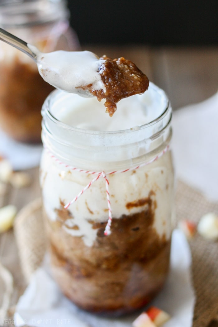 Cinnamon Caramel Apple Pecan Pie in a jar with a spoon scooping some out