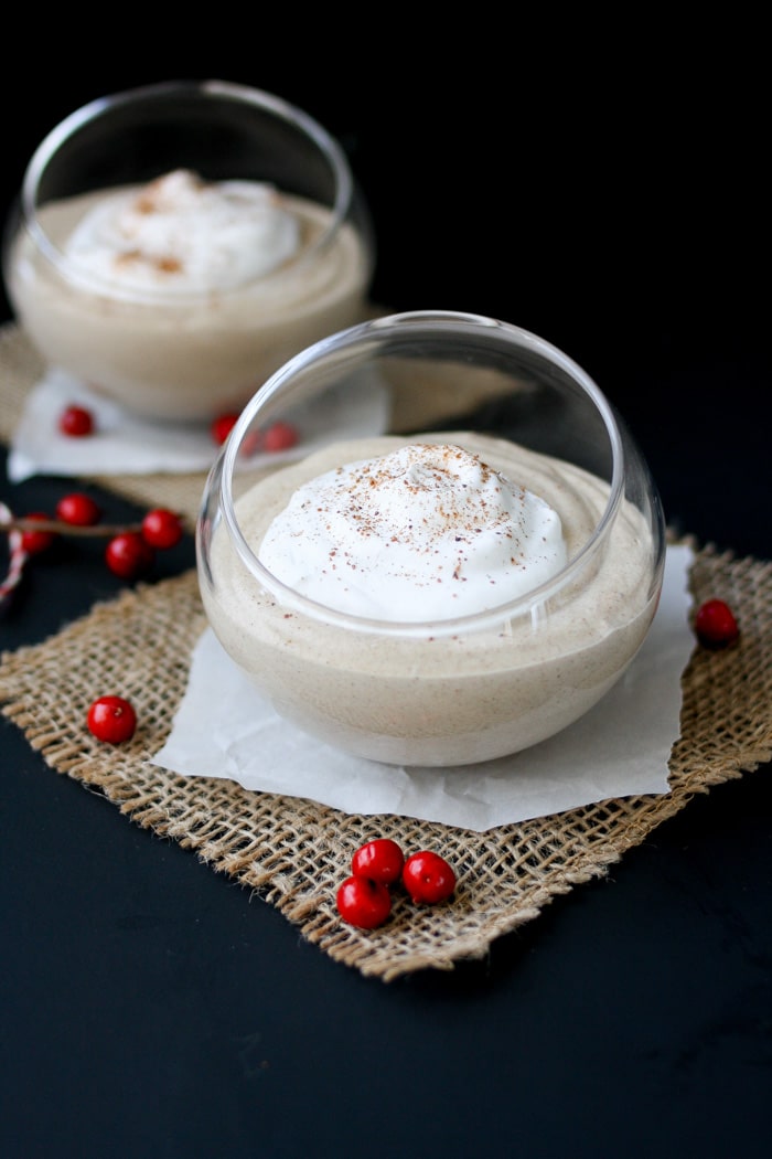 Starbucks latte inspired eggnog pudding with silk almond nog in a glass topped with cream