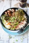An overhead shot of a Teriyaki Rice Bowl with Roasted Veggies drizzled with sauce