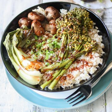 An overhead shot of a Teriyaki Rice Bowl with Roasted Veggies drizzled with sauce