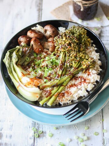 An overhead shot of a Teriyaki Rice Bowl with Roasted Veggies drizzled with sauce