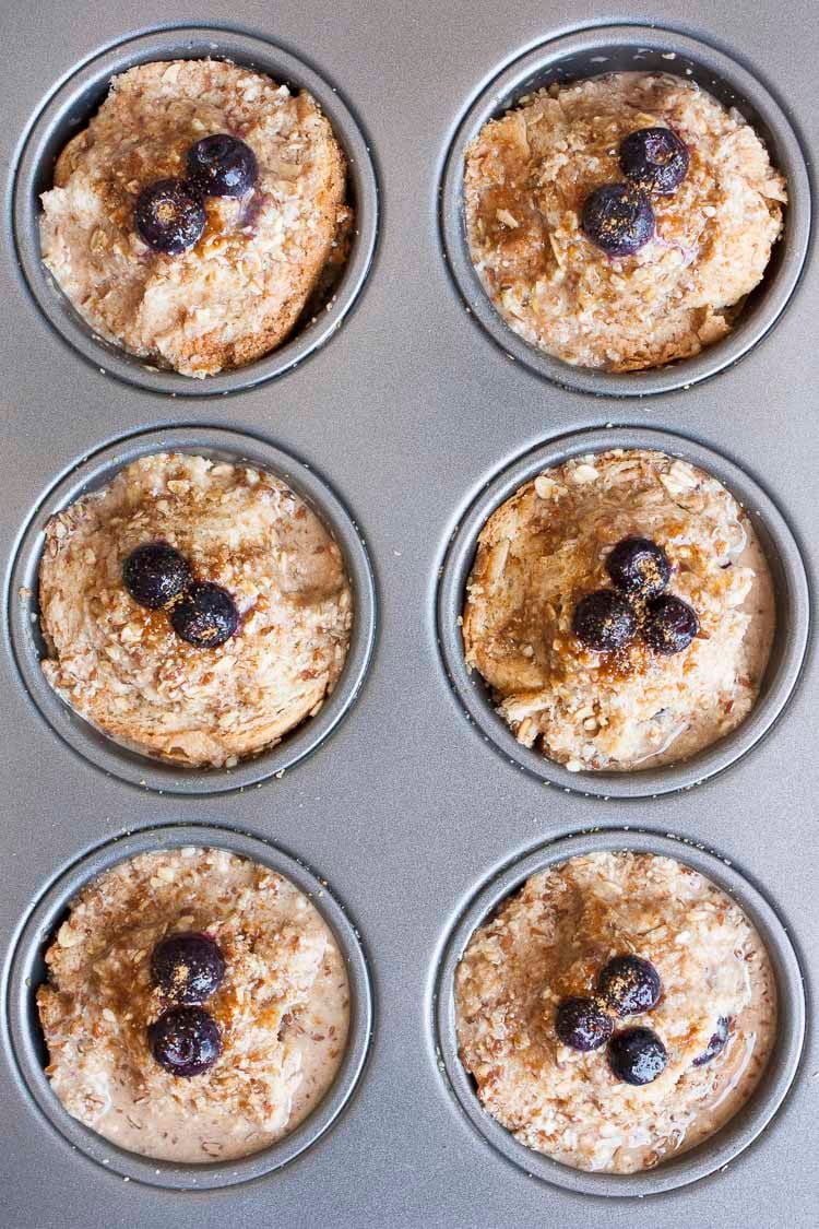 Top view of uncooked blueberry french toast muffins in a muffin tin