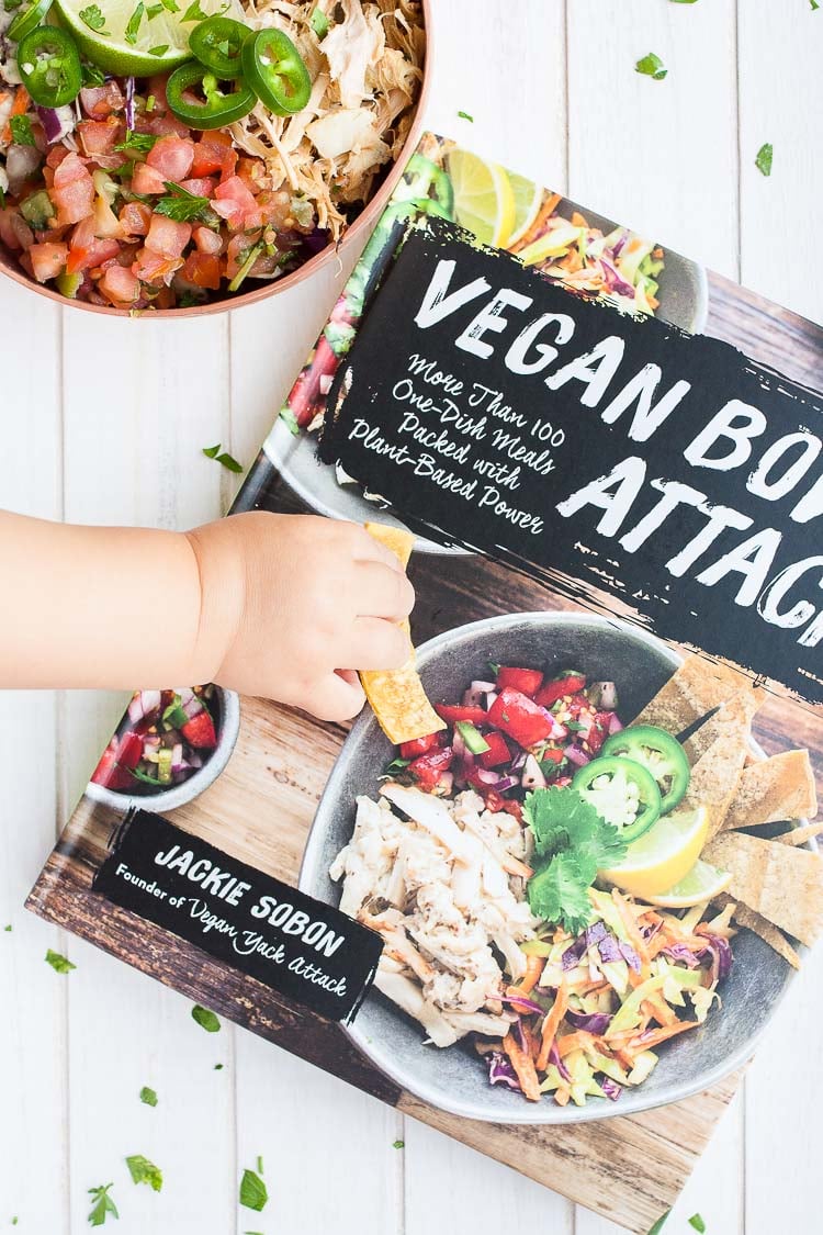 A close up of vegan bowl attack cookbook and a vegan fish taco bowl