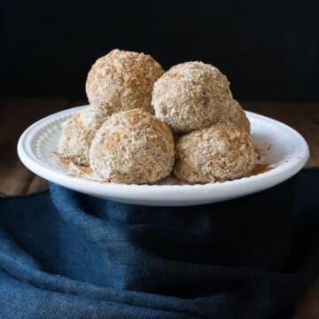 Unfried ice cream balls stacked on a plate