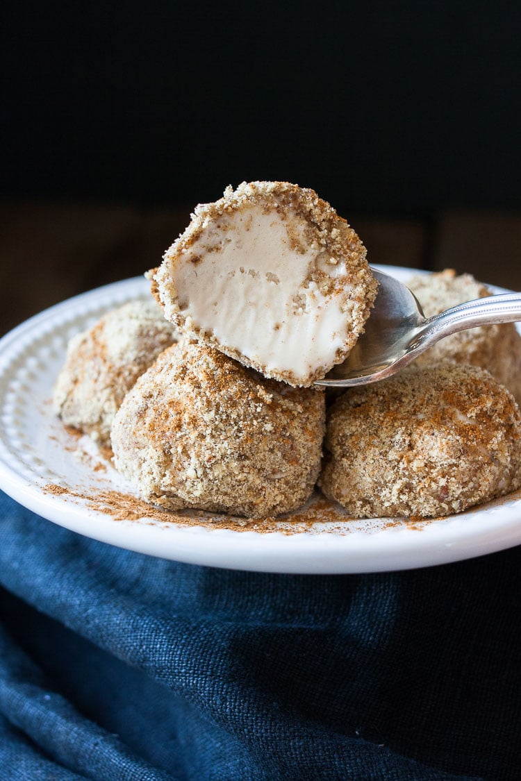 A close up of unfried ice cream with a bite out