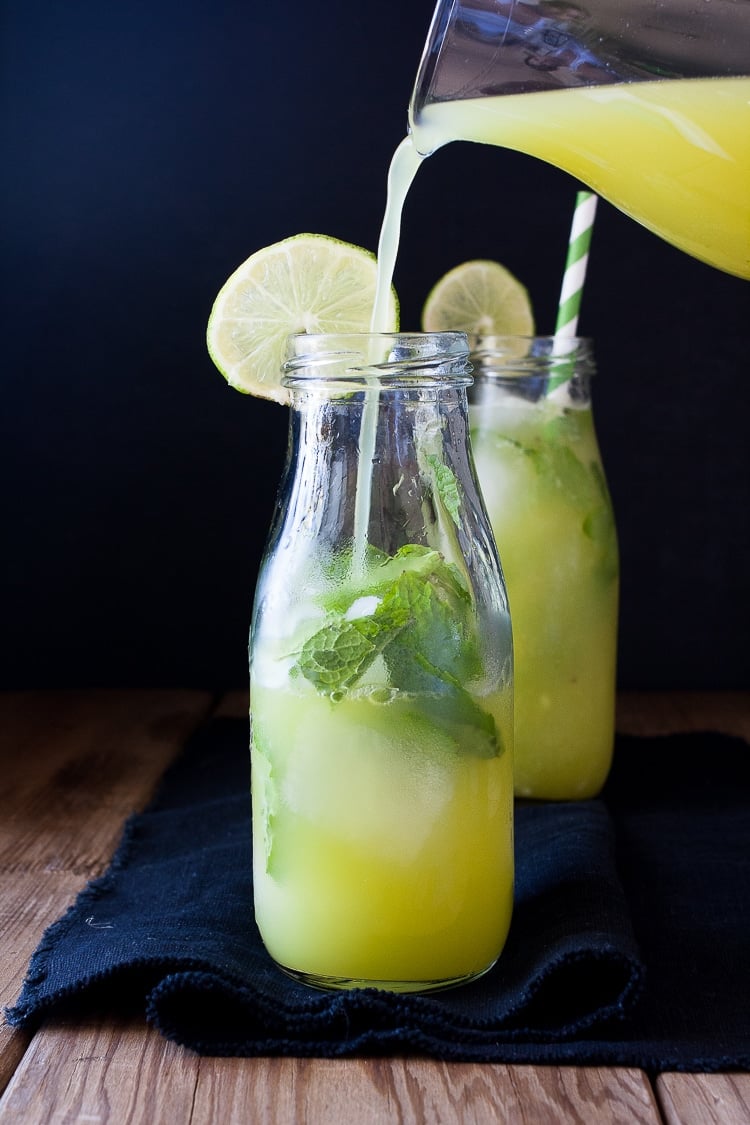 Fresh anti-inflammatory juice getting poured into a glass bottle