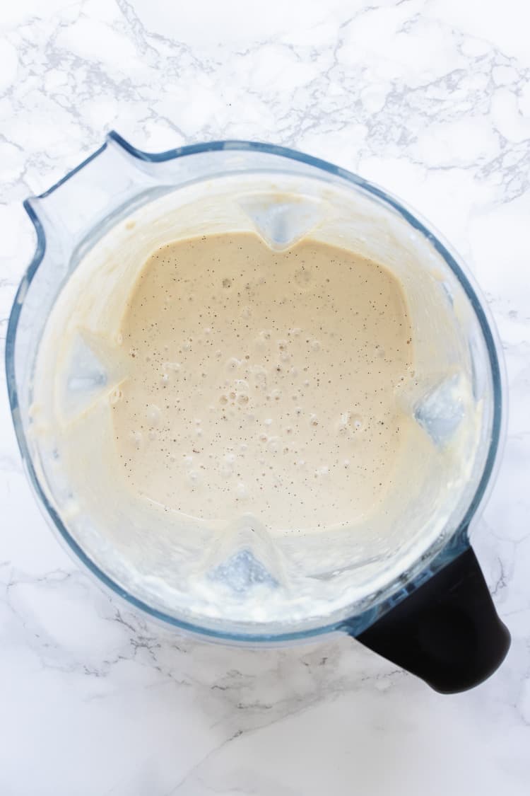 Top view of blender with white creamy pudding