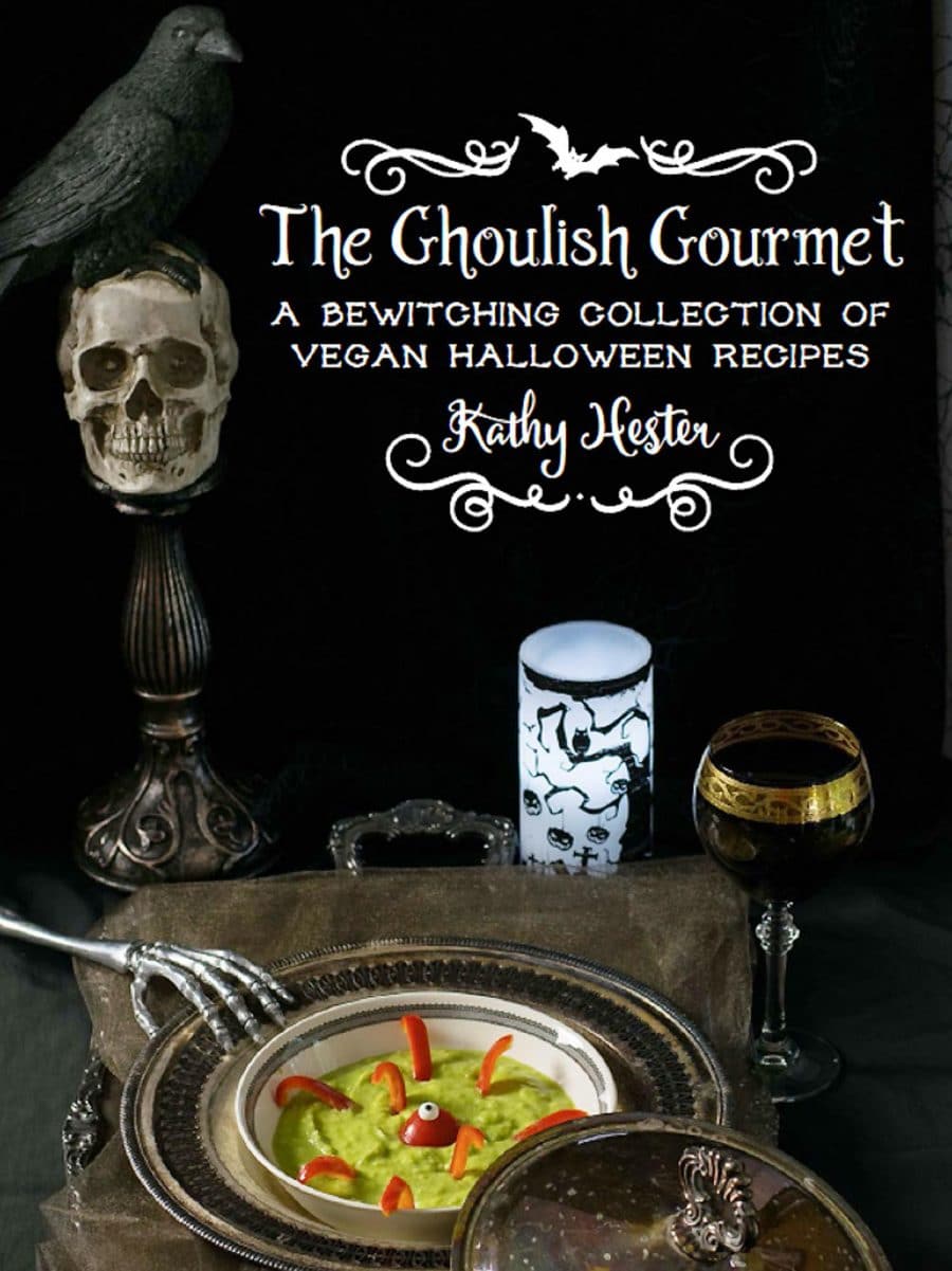 A book cover for vegan halloween recipes with a skull and bowl of green mush