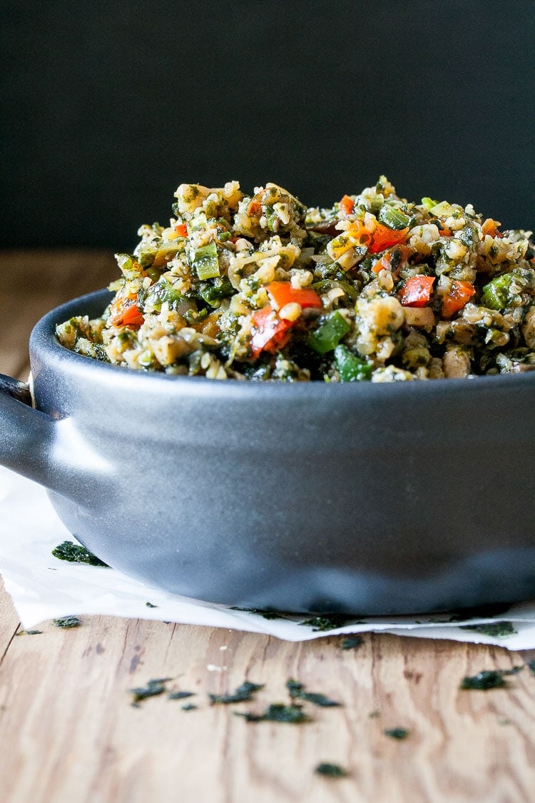 A close up of a blue bowl filled with Stir Fry Cauliflower Rice and veggies