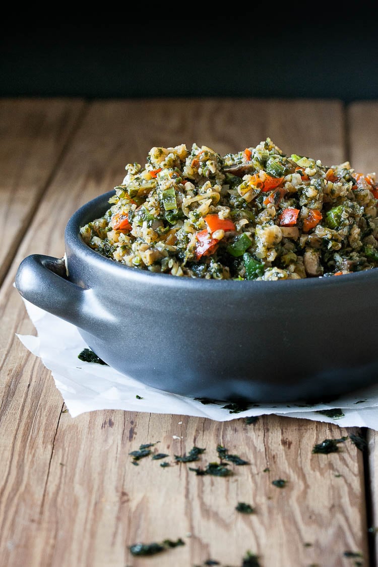 Superfood Stir Fry Cauliflower Rice in a blue bowl sitting on a wooden surface