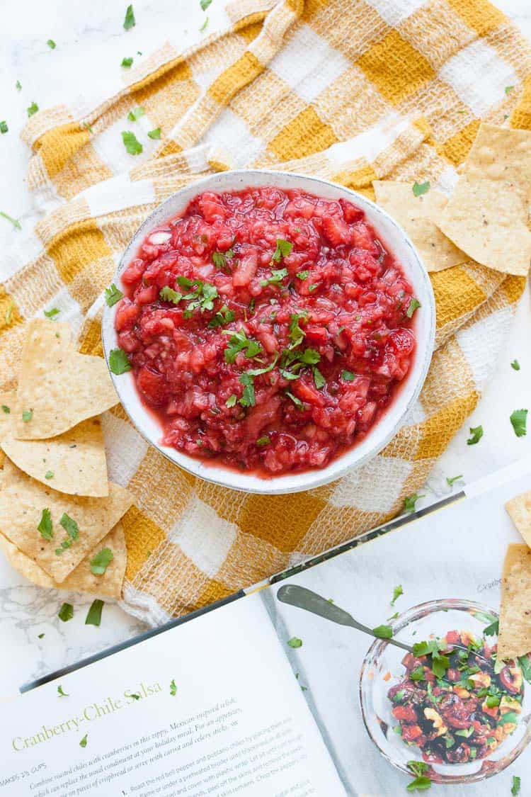 An overhead shot of spicy strawberry chile salsa in a white bowl