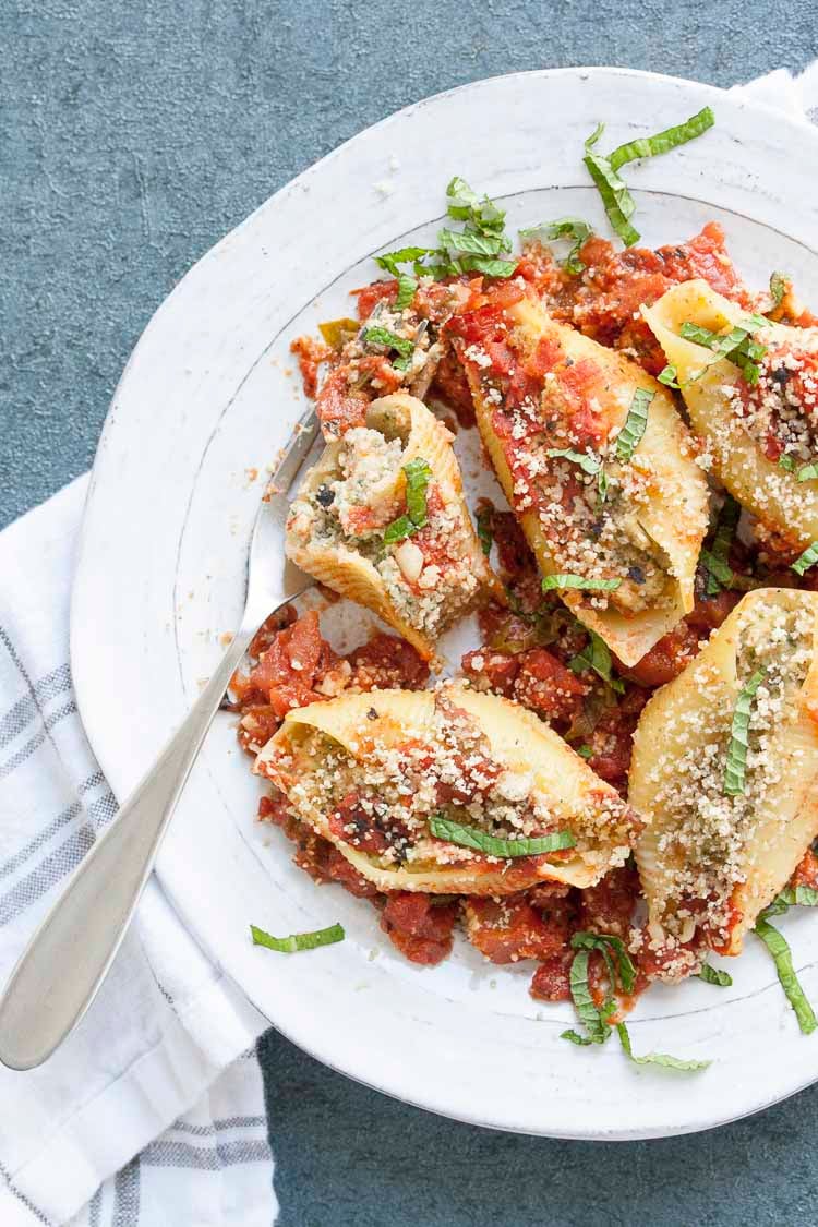 Partially eaten stuffed shells and cauliflower ricotta