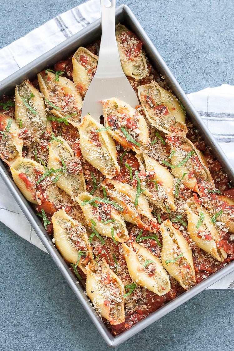 Pan of vegan stuffed shells with cauliflower ricotta