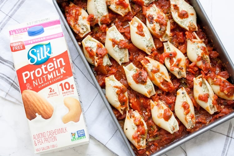 Silk Protein Nutmilk and pan of stuffed shells with cauliflower ricotta