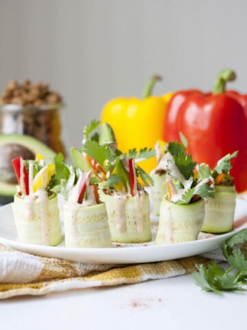 Raw zucchini stuffed with veggies and a raw walnut "meat"