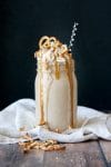 vegan protein salted carmel pretzel oatmeal cookie smoothie with a black background